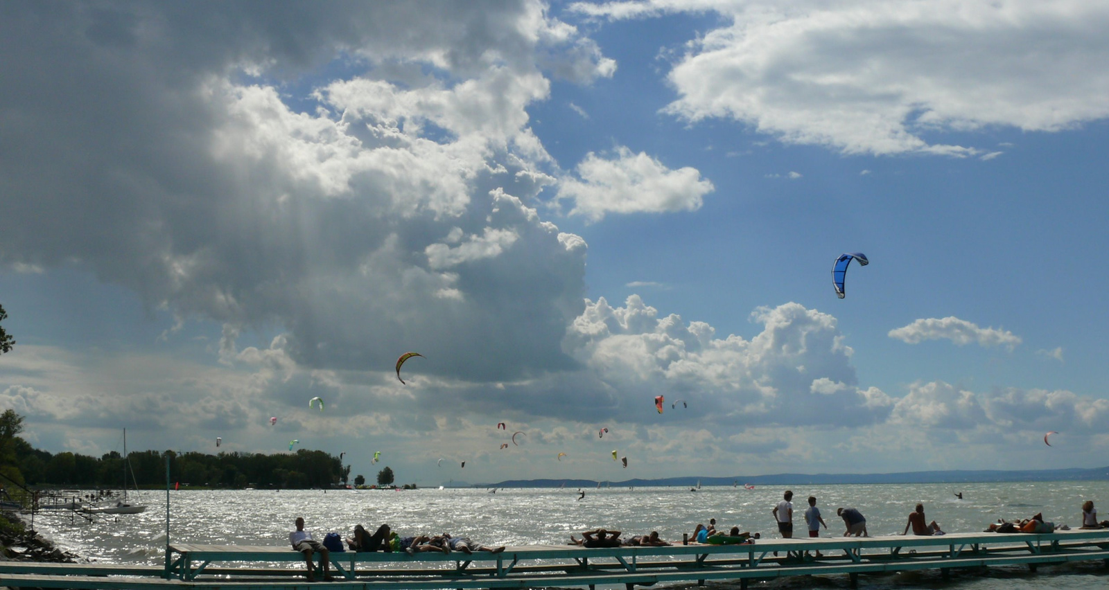 surfers and clouds