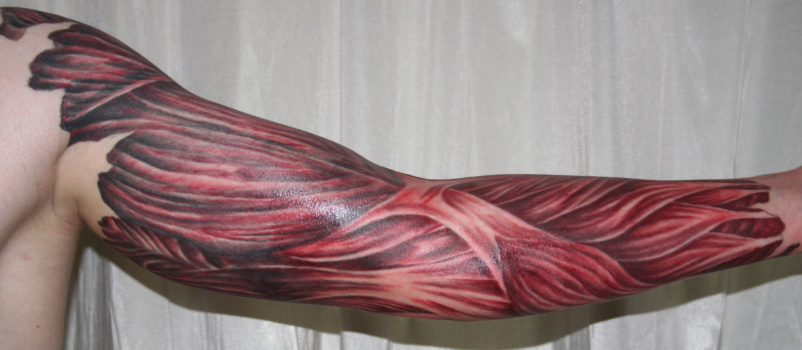 arm with muscle tissue5 Tattoo by 2Face Tattoo